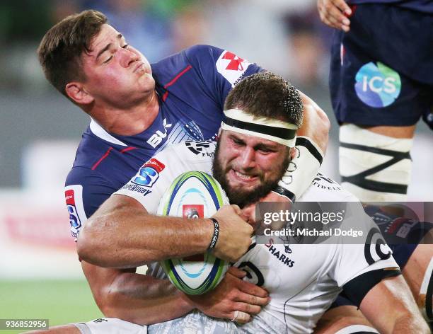 Thomas du Toit of the Sharks gets tackled by Ross Haylett-Petty of the Rebels during the round six Super Rugby match between the Melbourne Rebels and...