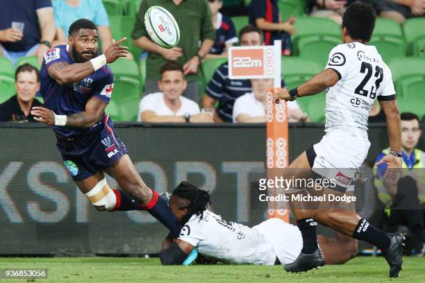 Marika Koroibete of the Rebels passes the ball during the round six Super Rugby match between the Melbourne Rebels and the Sharks at AAMI Park on...