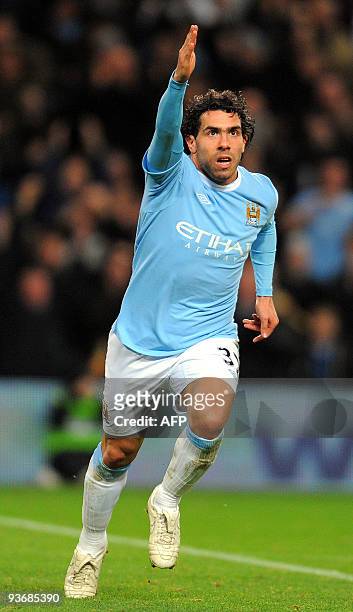 Manchester City's Argentinian forward Carlos Tevez celebrares after opening the score during the Carling Cup quarter final football match against...