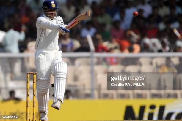 Indian cricketer Virendra Sehwag plays a shot during his unbeaten 284 runs at the end of second day of the third test between India and Sri Lanka in...