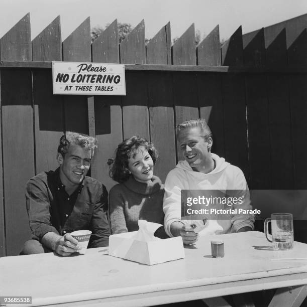 American actress and singer Shelley Fabares with singer Jan Berry and Dean Torrence, of American pop singing duo Jan and Dean, at an amusement park...