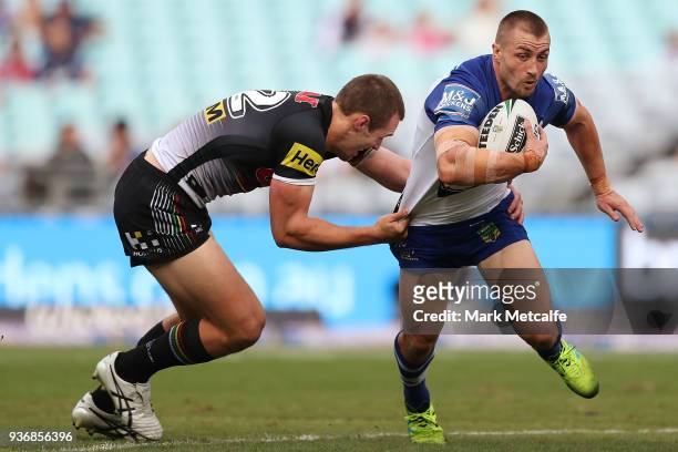 Kieran Foran of the Bulldogs is tackled during the round three NRL match between the Bulldogs and the Panthers at ANZ Stadium on March 23, 2018 in...
