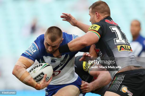 Kieran Foran of the Bulldogs is tackled during the round three NRL match between the Bulldogs and the Panthers at ANZ Stadium on March 23, 2018 in...