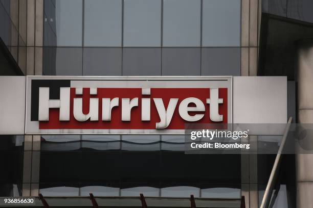 Logo sits on display above the entrance to the Hurriyet newspaper offices at the Dogan Media center, operated by Dogan Yayin Holding AS, in Istanbul,...