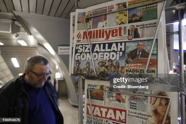 Copies of Milliyet and Vatan newspapers, published by Dogan Yayin Holding AS, sit on a news stand inside a metro station in Istanbul, Turkey, on...