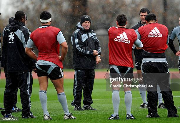 Head Coach Graham Henry talks to his players during an All Blacks training session at Harrow School on December 3, 2009 in London, England.