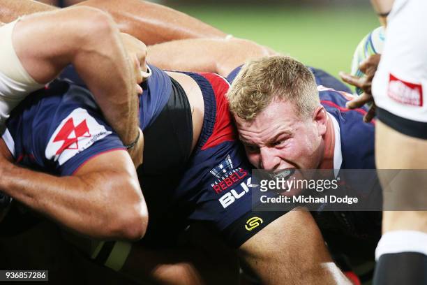 Angus Cottrell of the Rebels pushes hard in the scrum during the round six Super Rugby match between the Melbourne Rebels and the Sharks at AAMI Park...