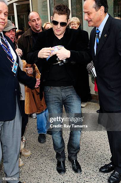 Singer Michael Buble leaves the "Live With Regis And Kelly" taping at the ABC Lincoln Center Studios on December 02, 2009 in New York City.