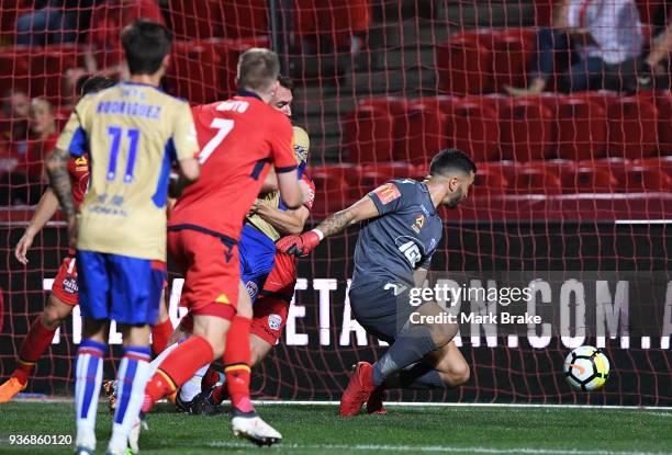 Paul Izzo goal keeper of Adelaide United watches a Newcastle goal slip by him during the round 24 A-League match between Adelaide United and the...