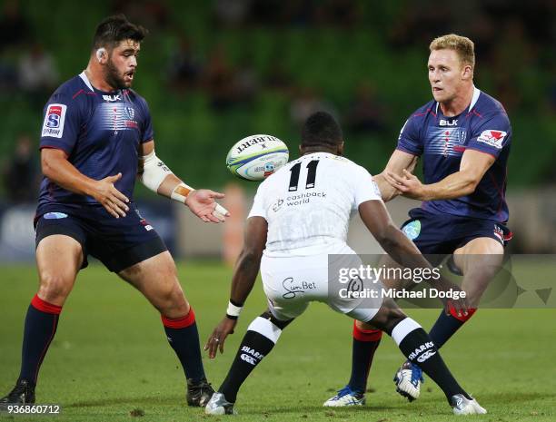 Reece Hodge of the Rebels passes the ball Rebelsduring the round six Super Rugby match between the Melbourne Rebels and the Sharks at AAMI Park on...