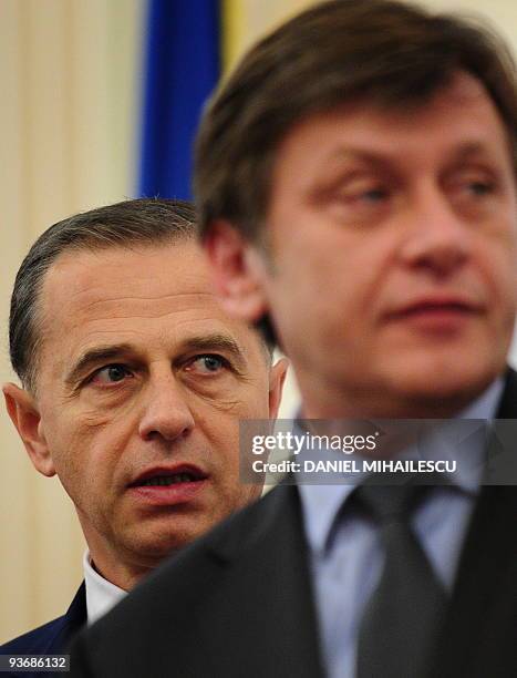 Social Democratic Party Presidential candidate, Mircea Geoana , walks next to National Liberal Party presidential candidate, Crin Antonescu , prior...
