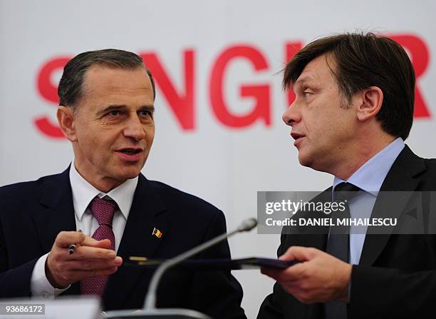 Social Democratic Party Presidential candidate, Mircea Geoana , speaks with National Liberal Party presidential candidate, Crin Antonescu , after...