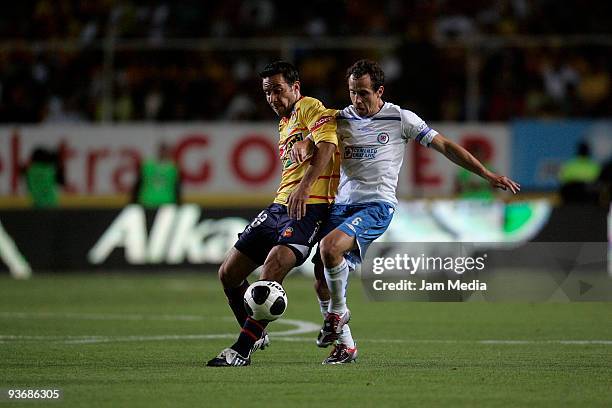 Morelias' Luis Gabriel Rey vies for the ball with Cruz Azul Gerardo Torrado during their semifinals match as part of the 2009 Opening tournament in...
