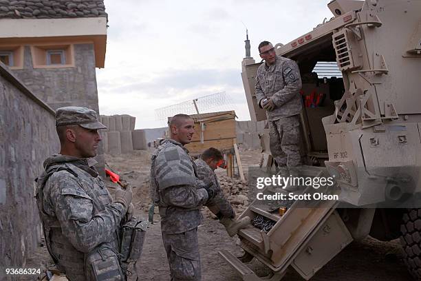 Soldiers from the Army's Blackfoot Company 1st Battalion 501st Parachute Infantry Regiment prepare to roll out of the Sarhowza District Center in an...