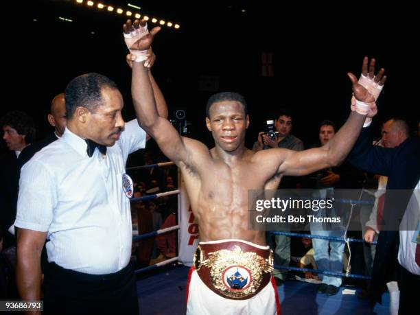 Referee Richard Steele with the WBO World Middleweight Champion Chris Eubank of Great Britain after his victory over Nigel Benn at the National...