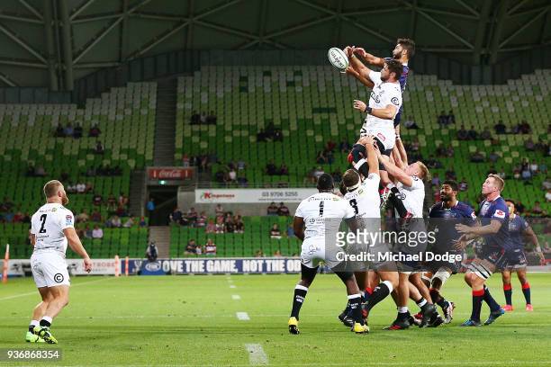 Colby Fainga'a of the Rebels competes for the ball over the top during the round six Super Rugby match between the Melbourne Rebels and the Sharks at...