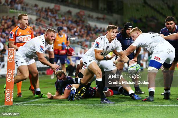 Louis Schreuder of the Sharks passes the ball during the round six Super Rugby match between the Melbourne Rebels and the Sharks at AAMI Park on...