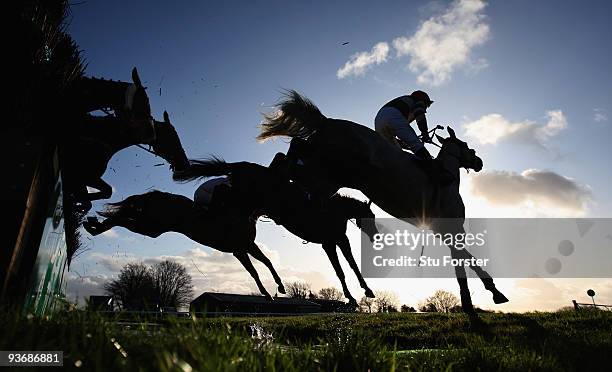 The field clear the water jump during the Weatherby's bank silver buck handicap chase at Wincanton Racecourse on December 3, 2009 in Wincanton,...