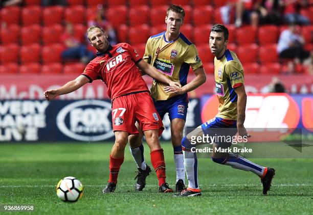 Cof Adelaide United makes a pass under pressure during the round 24 A-League match between Adelaide United and the Newcastle Jets at Coopers Stadium...
