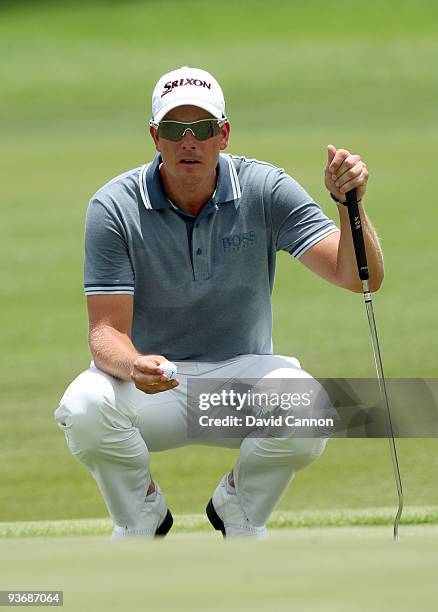 Henrik Stenson of Sweden lines up a putt on the 1st green during the first round of the Nedbank Golf Challenge at the Gary Player Country Club at Sun...