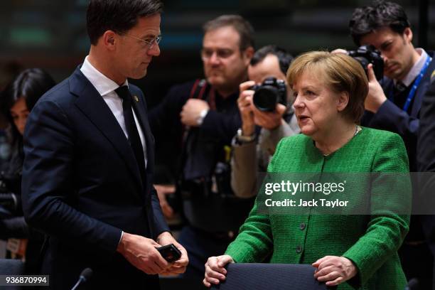 German Chancellor Angela Merkel speaks with Netherland's Prime Minister Mark Rutte ahead of roundtable discussions in the Europa Building on the...