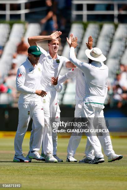 South African bowler Morne Morkel celebrates the dismissal of Australian batsman Steven Smith during the second day of the third Test cricket match...