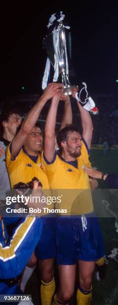 Juventus captain Gaetano Scirea with Marco Tardelli celebrate with the trophy after the Juventus v Porto European Cup Winners Cup Final played at the...