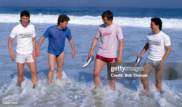 Englnad footballers : Mike Duxbury, Tony Woodcock, Graham Roberts and Kenny Sansom in the sea at Copacabana beach in Rio de Janeiro during the team's...