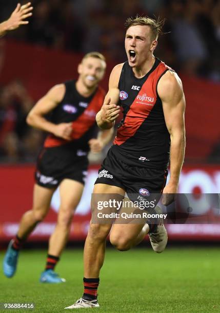 Joshua Begley of the Bombers celebrates kicking a goal during the round one AFL match between the Essendon Bombers and the Adelaide Crows at Etihad...