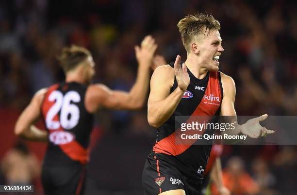 Joshua Begley of the Bombers celebrates kicking a goal during the round one AFL match between the Essendon Bombers and the Adelaide Crows at Etihad...