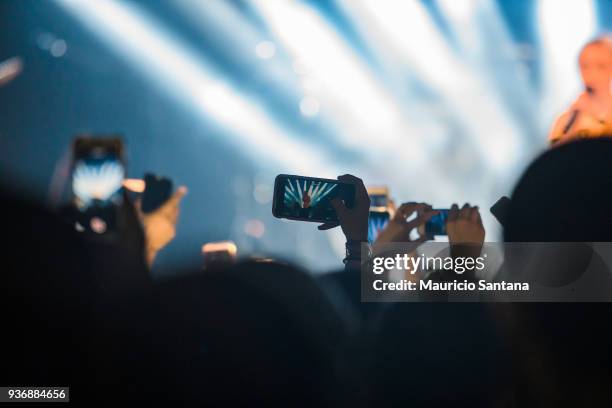 Audience using smartphone with instagram stories , facebook and snapchat to record Zara Larsson concert at Audio Club on March 22, 2018 in Sao Paulo,...