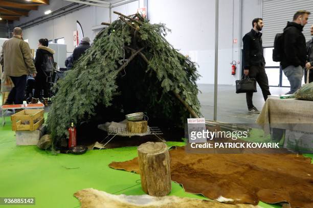 People visit the Survival Expo on March 23, 2018 in Paris. Survivalists also known as "Preppers" believe it's important to be prepared for a major...