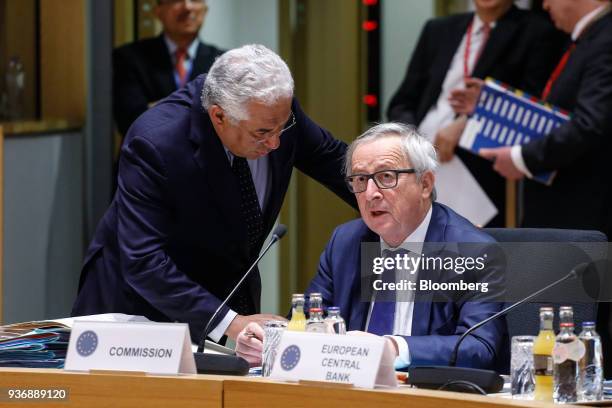 Antonio Costa, Portugal's prime minister, left, speaks with Jean-Claude Juncker, president of the European Commission, ahead of roundtable...