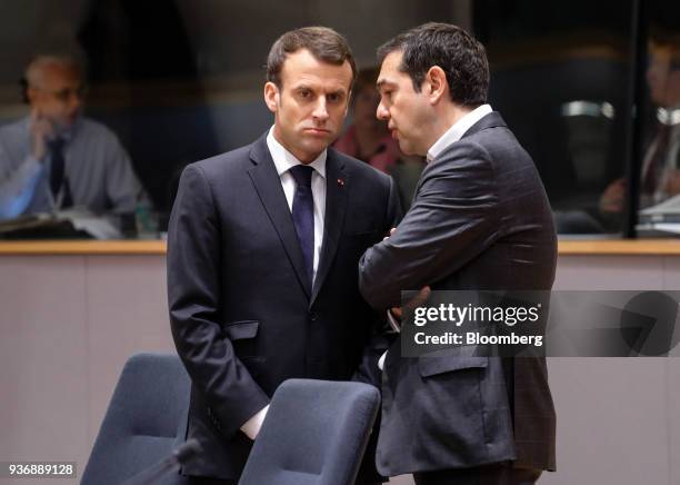 Emmanuel Macron, France's president, left, speaks to Alexis Tsipras, Greece's prime minister, ahead of roundtable discussions during a summit of...