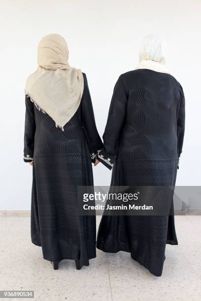 two muslim women - hijab woman from behind stock-fotos und bilder