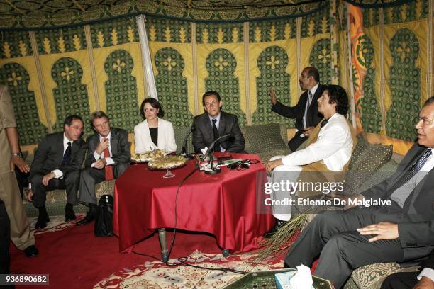 French President Nicolas Sarkozy meets with Libyan Leader Muammar Gaddafi inside a beduin tent at Bab Al Azizya compound during an official visit in...