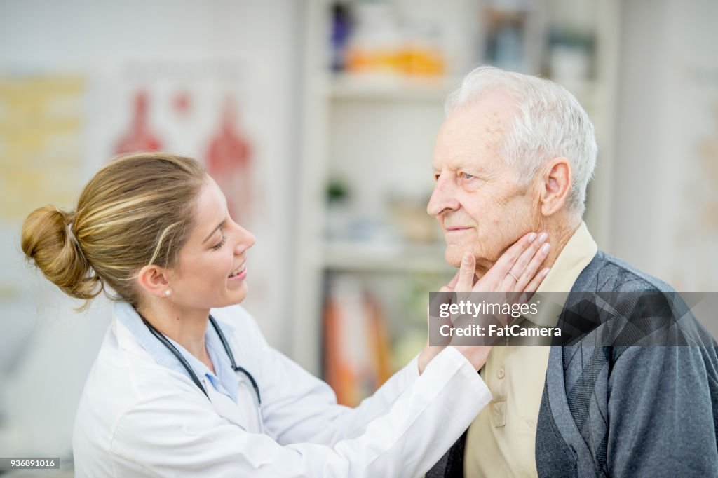 Looking At A Patient's Neck
