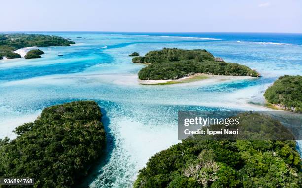 tropical paradise from above, ishigaki island, japan - okinawa blue sky beach landscape stock-fotos und bilder