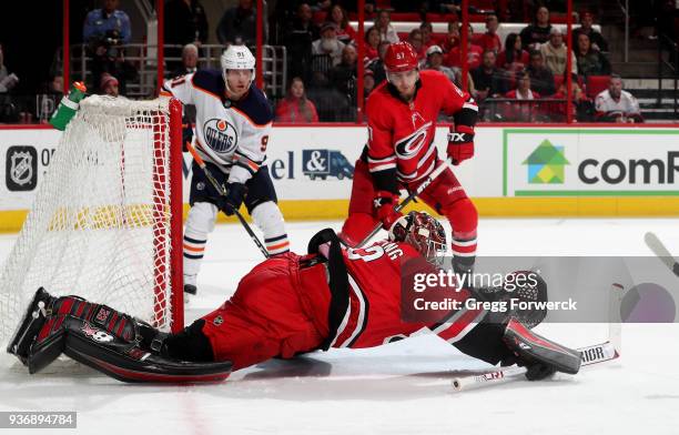Scott Darling of the Carolina Hurricanes dives toward the crease to make a save during an NHL game against the Edmonton Oilers on March 20, 2018 at...