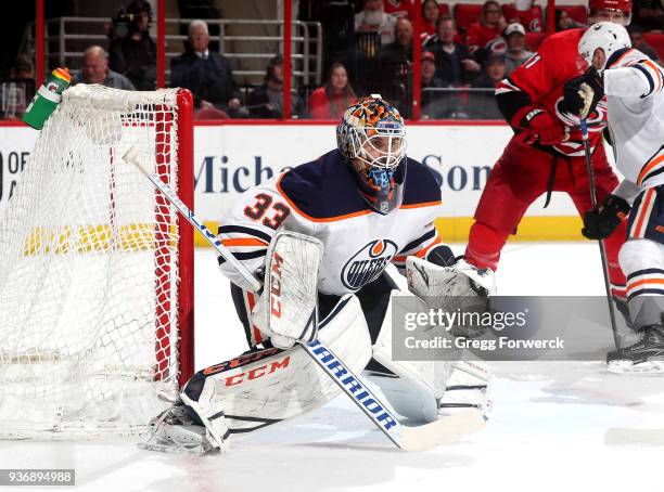 Cam Talbot of the Edmonton Oilers crouches in the crease to defend the net during an NHL game against the Carolina Hurricanes on March 20, 2018 at...