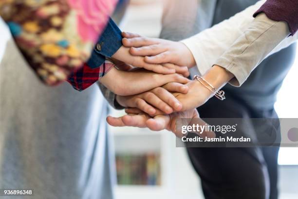 arab family with hands in circle - hands together stock pictures, royalty-free photos & images