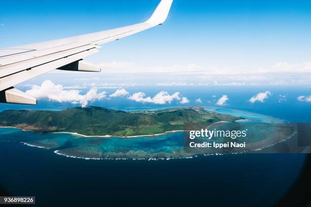 aerial view of tropical island with coral reefs, ishigaki, japan - ala de avión fotografías e imágenes de stock