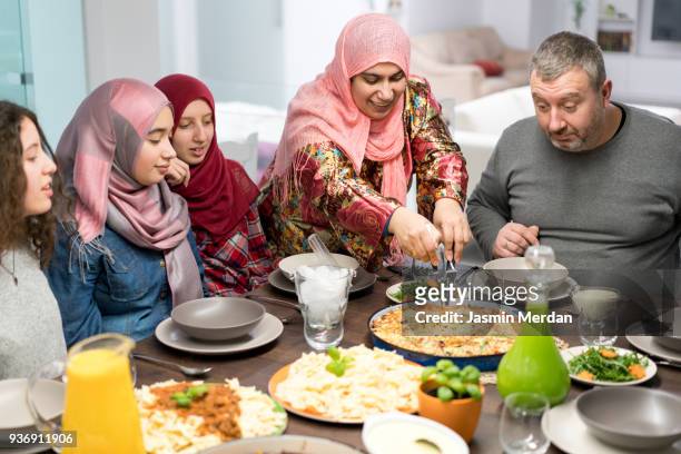 muslim family gathering for iftar food in ramadan - arabic food stock-fotos und bilder