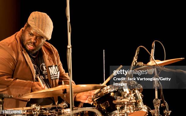 American Jazz musician Johnathan Blake plays drums as he performs with the Arturo O'Farrill Band during a 'Musicians Against Fascism' benefit concert...