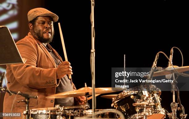 American Jazz musician Johnathan Blake plays drums as he performs with the Arturo O'Farrill Band during a 'Musicians Against Fascism' benefit concert...