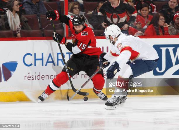 Zack Smith of the Ottawa Senators stickhandles the puck against Keith Yandle of the Florida Panthers at Canadian Tire Centre on March 20, 2018 in...