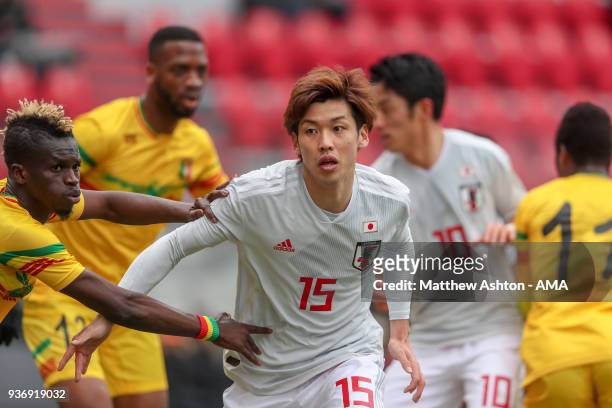 Souleymane Diarra of Mali holds on to Yuya Osako of Japan during the International friendly match between Japan and Mali at the Stade de Sclessin on...