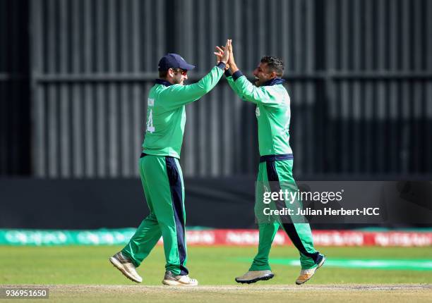 Gary Wilson and Simi Singh of Ireland celebrate the wicket of Muhammad Nabi of Afghanistan during The ICC Cricket World Cup Qualifier between Ireland...