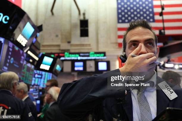 Traders work on the floor of the New York Stock Exchange on March 23, 2018 in New York City. Despite yesterday's massive loss due to trade war fears...