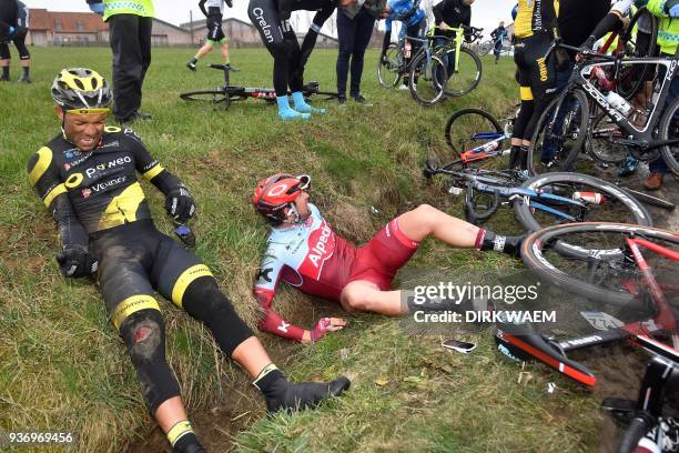 French Yohann Gene of Direct Energie and Austrian Marco Haller of Katusha-Alpecin lie in a ditch after a fall during the 61st edition of the 'E3...